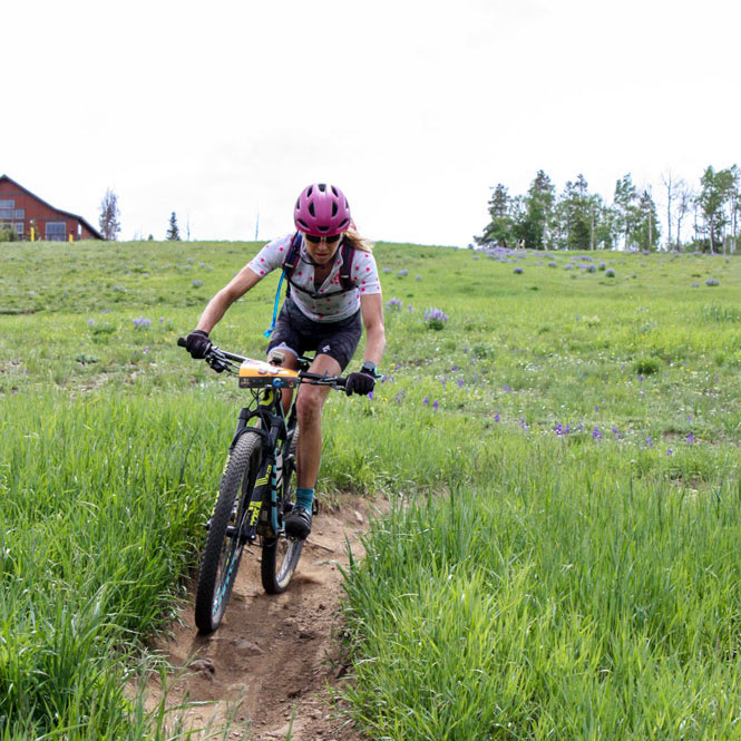 Dr. SIlver biking on a dirt path outside of Boulder CO